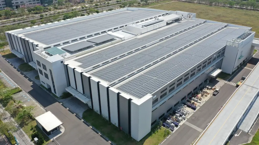 Modern factory building with roof mounted solar system.
