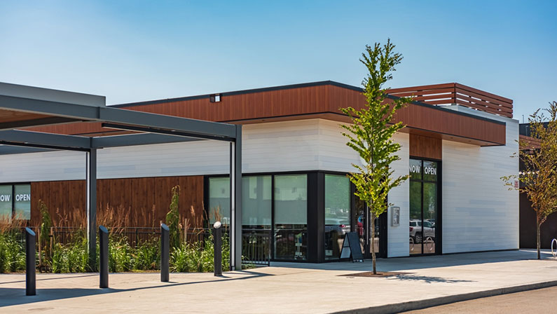 Photo of the mall shopping street in North America. Exterior of a new shopping centre building. Mall complex outdoor. Nobody, street photo