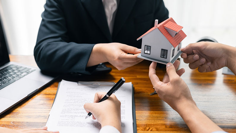 Real estate agent facilitated sale of property through mortgage loan, ensuring smooth investment process for purchaser with help of skilled broker. Concept of loan, insurance, approval, real estate.