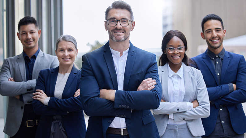 Business people, portrait and group outdoor in city for corporate work as legal advisors or attorneys for real estate. Team, serious and confident with arms crossed for management strategy and leader