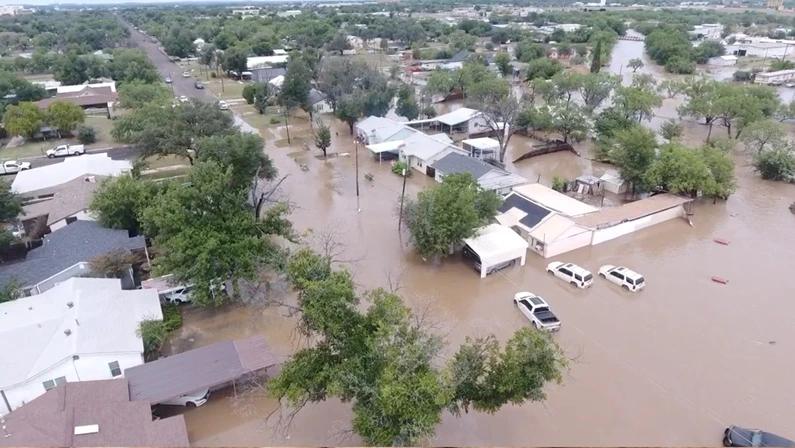 Severe flooding in Texas submerges homes, roads, and farmland, causing widespread damage and displacement.